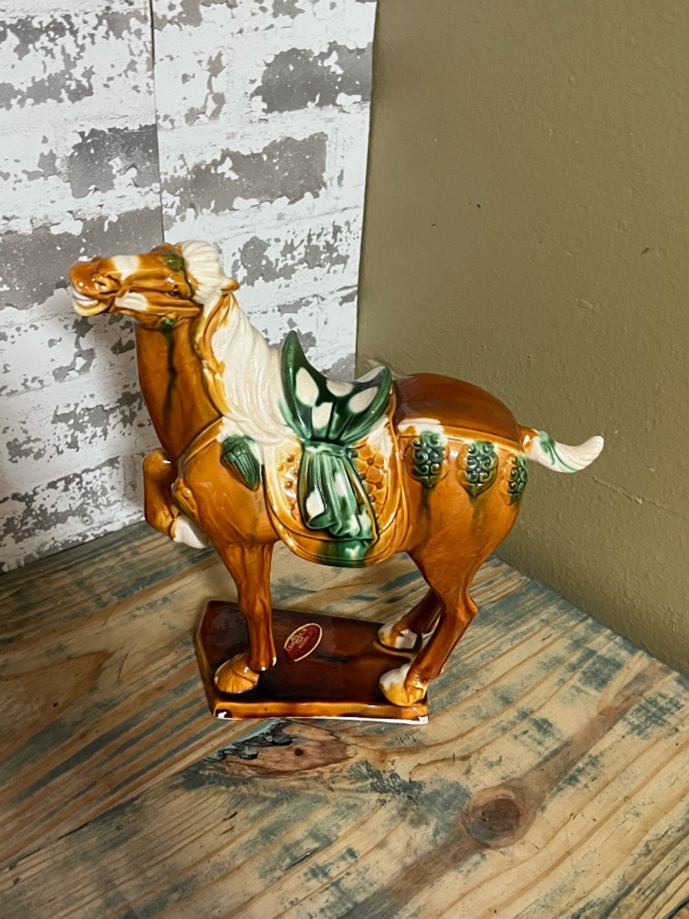 Vintage Tang-style glazed ceramic horse statue featuring a rich caramel body